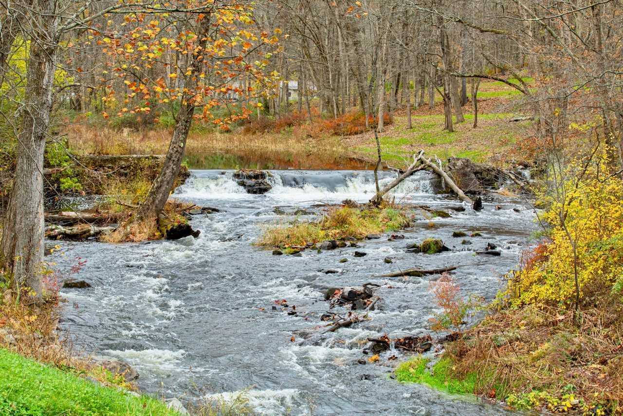 River flowing during fall in New England, fall foliage